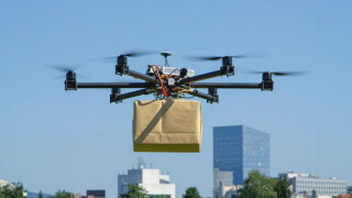 na-usa-emg-nvh-drone-carrying-package-640x428.jpg